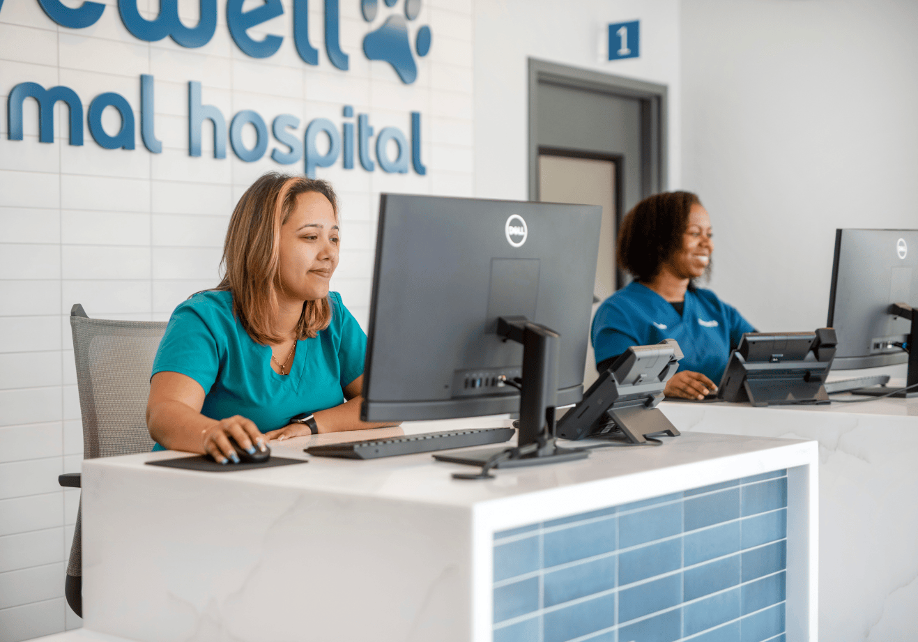Two receptionists at their stations at the Livewell Riverview location
